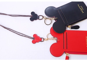 Close-up of black and red cartoon mouse shape card holders with detachable lanyards