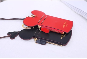 Detail view of Mickey-shaped mini card holders with 'HAPPY dream' print and lanyards
