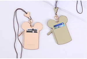 Detail of Mickey-shaped ID card holders in apricot and green with zipper and lanyard