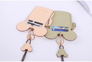 Detail view of cartoon card holders with Mickey ears, zip pocket and neck lanyard