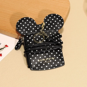 Detailed view of Mickey-themed card holder with polka dots, metal zipper, and keychain