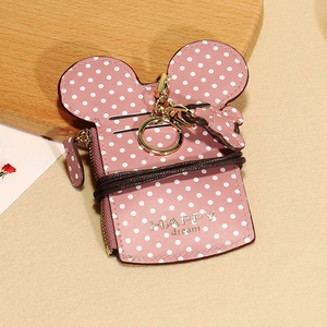Pink polka dot card holder featuring Mickey ears and golden Happy Dream text detail