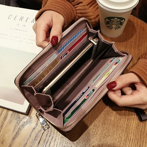 Pink long zip-around leather wallet for women with multi-card slots and phone compartment