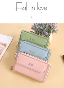 Detailed view of colorful PU leather cross-body bags in pink, blue, and green finishes