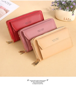 Detail view of multi-color PU leather crossbody wallets with heart-shaped gold zippers