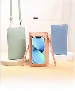 Detail of touch-screen window on mini crossbody phone bags in various colors