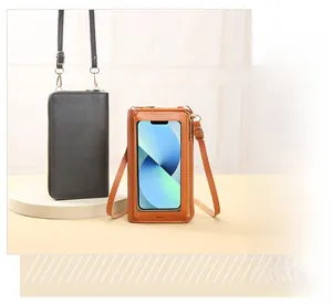 Detail of touchscreen window and leather texture on cross-body mini cell phone bags