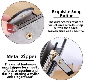 Detail view of the elegant snap closure and smooth hardware zipper on gray wallet
