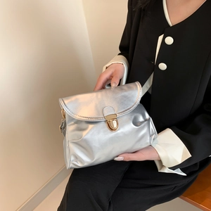 Modern silver metallic handbag with large capacity and elegant gold buckle clasp