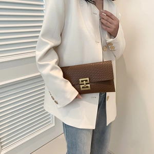 Chic brown envelope clutch bag with snake texture and gold buckle for women