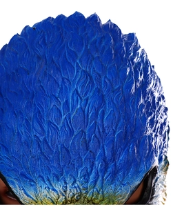 Macro detail of the realistic 3D blue feather textures and yellow gradients on bird mask