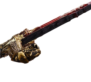 Close-up of golden dragon-themed sword hilt with intricate scales and red blade