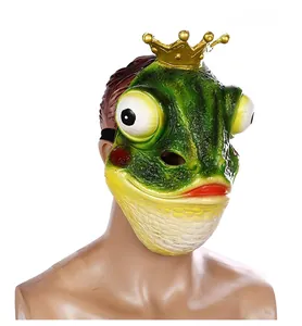 Detail of green frog prince mask with golden crown and realistic skin texture