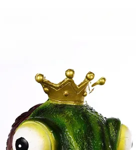 Close-up of green frog head mask with realistic skin texture and gold crown detail