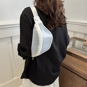 Modern translucent white PVC chest bag with wide strap shown on model in indoor setting