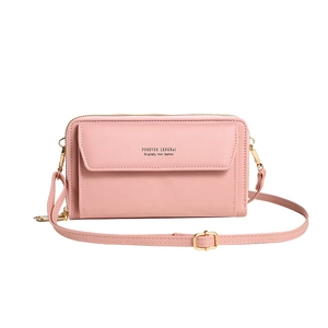 Pink minimalist crossbody bag with dual zippers and adjustable shoulder strap for women