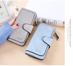 Close-up of frosted leather long wallet with buckle closure in grey and blue colors