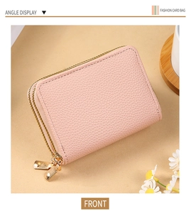 Front angle display of a pink litchi grain leather card holder with double gold zippers