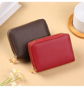Close-up of double zipper PU leather card holder with litchi texture and gold hardware