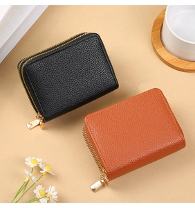 Dual-zipper accordion card wallets in black and orange litchi grain leather texture
