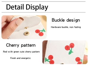 Detail display of cherry print leather pouch with golden hardware buckle closure