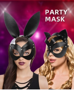 Detail of black rabbit and cat party masks with silver studs and ribbon ties
