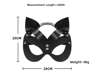 Detail of black faux leather cat mask featuring metallic silver rivets and wide straps
