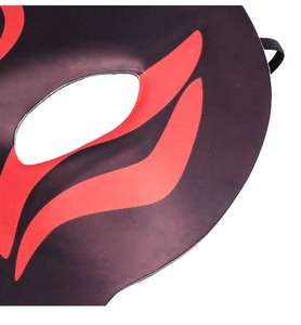 Detail of red and black fox mask featuring streamline flame spray paint and elastic strap