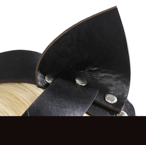 Macro detail of black leather cat ear headband with silver metal rivets and punk texture