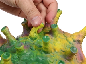 Macro shot of a soft squeeze stress toy showing its colorful flexible tentacles and texture