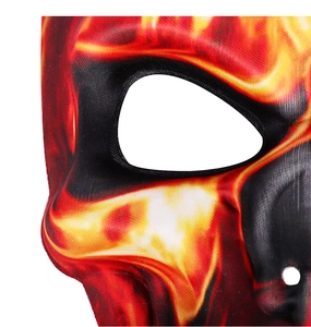 Detailed macro view of the Halloween mask with vibrant orange and red flame patterns