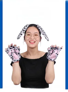 Detail of dalmatian dog headband and plush gloves with pink paw pads for cosplay