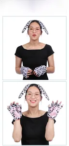 Detail of spotted dog plush headband and paw gloves with pink pads for cosplay