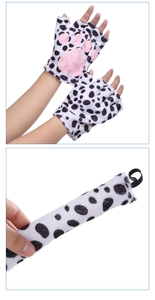 Detail of spotted dog plush gloves with pink paw pads and matching tail for costumes