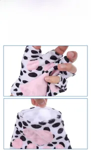 Detail of plush animal paw gloves with pink paw pads and cow print faux fur texture