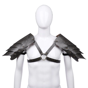 Medieval viking leather shoulder armor with dragon scale design and brass rivets