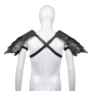 Detail of medieval vintage leather shoulder armor with rivets and multi-layer scale design