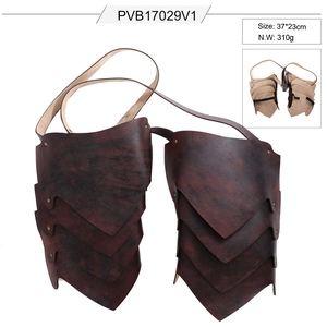 Detail view of dark red leather Viking shoulder armor with rivets and adjustable straps