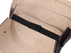 Detail of Viking shoulder armor with brown leather layers and black elastic strap