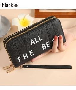 Detail of black double zipper long wallet with ALL THE BEST text and lychee texture
