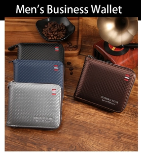 Detail of multi-color men's wallets with carbon fiber texture on dark wooden surface