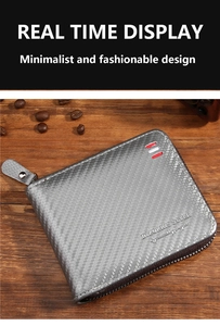 Detail of silver gray carbon fiber wallet with metallic zipper on wooden surface