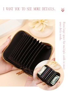 Detail of pink leather accordion card wallet with multi-slot design and metal zipper