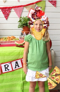 Detail of colorful ice cream cone mask and pizza props for festive party photo booths