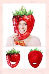 Macro detail of strawberry plush hat with green leaf and chocolate syrup decoration
