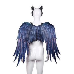 Detailed view of purple feather print wings and matching headband on a mannequin