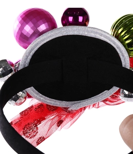 Close-up of Christmas headband back with red polka dot mesh and colorful bell ornaments