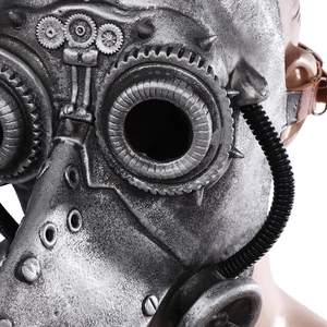 Detail of silver steampunk plague doctor mask featuring gears, goggles and metal rivets