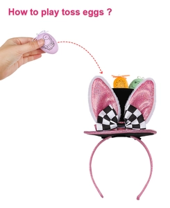 Action shot showing how to play the Easter bunny hoop game with egg-shaped toss items