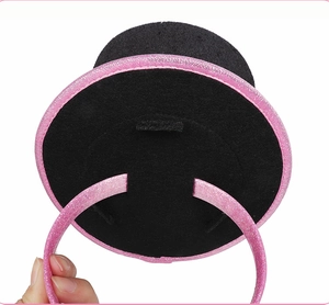 Detail of pink glitter headband with a black felt mini hat for Easter party fun